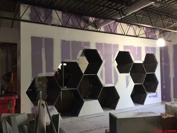New media center is merging with student-sized hive cubbies 